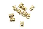 A top-down view of ten small brass flanged pivot balls for RC vehicles scattered on a white background.