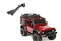 A black rubber snorkel accessory for an RC car shown floating above a red Traxxas TRX-4 Defender RC crawler.