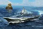 Box art illustration of a Chinese PLA Navy Type 002 aircraft carrier at sea with fighter jets and an explosion in the background.