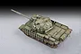 A high-angle studio shot of a finished 1/72 scale plastic model of a Russian T-62 tank with ERA armor, painted in olive green with weathering effects.