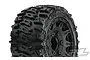 A close-up of a Pro-Line 2.8 inch Trencher tyre mounted on a black Raid rim, showing the aggressive tread pattern and wheel detail.