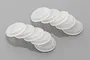 A set of ten translucent white rubber shock cap seals for RC vehicles arranged in two stacks on a grey background.