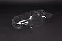 A clear, unpainted polycarbonate body shell for an ARRMA 1/10 Kraton 4S RC truggy, shown from a high-angle perspective against a dark background.