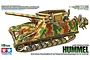 Box art for Tamiya 1/35 scale German Hummel Late Production self-propelled howitzer model kit, showing a camouflaged tank with figures and artillery shells.