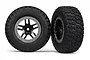 Two Traxxas 2.2/3.0 inch BFGoodrich Mud Terrain T/A KM2 tyres pre-mounted on black and satin chrome split-spoke wheels.