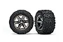 Two Traxxas 2.8 inch Talon Extreme tyres mounted on black chrome RXT rims, shown from front and angled views against a white background.