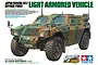 Box art for Tamiya 1/35 scale Japanese Ground Self Defense Force Light Armored Vehicle model kit, showing a camouflaged military vehicle.