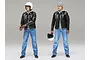Two 1/12 scale Tamiya Street Rider plastic model figures standing against a plain grey background, one wearing a helmet and one holding it.