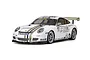 A 1/10 scale Tamiya RC Porsche 911 GT3 Cup car model, finished in white with gold racing stripes and various sponsor decals, shown on a white background.