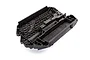 A black molded plastic main chassis for a Traxxas Maxx 4S RC vehicle, featuring a honeycomb reinforcement pattern.