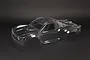 An unpainted, clear polycarbonate RC short course truck body shell for the ARRMA Mojave 1/7 scale model, shown against a dark background.