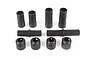 A set of black plastic RC drivetrain components including splined shafts, sleeves, and collars on a white background.