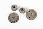 A set of four metal transmission gears for an RC vehicle, arranged on a plain white background.
