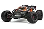 ARRMA Kraton 8S BLX 1/5 scale electric RC truggy in orange and black, viewed from a front three-quarter angle against a white background.