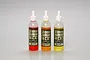 Three Tamiya silicone damper oil bottles in red, orange, and yellow, each labeled SOFT and containing 20cc of fluid.