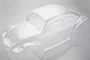 An unpainted, clear polycarbonate RC car body shell shaped like a classic beetle, viewed from a high angle against a light grey background.