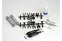 Traxxas XX-Long black shock absorber kit including two shock bodies, springs, plastic parts tree, silicone oil, and assembly diagram.