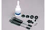 Traxxas PTFE-coated aluminium shock absorber set including two shocks, silicone oil, and various small plastic and metal mounting hardware components.