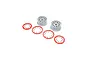 Two silver RC car wheel rims with four red beadlock rings and associated mounting screws on a white background.