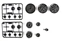 Tamiya TT-02 Gear Set Parts Bag G containing various black plastic differential gears, spur gear, and housing components on a white background.