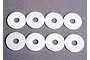 Eight white circular plastic body shell washers arranged in two rows of four on a grey surface.