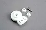 Traxxas servo saver assembly including white plastic servo horn, two small white plastic bushings, and a metal screw on a grey background.