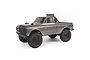A silver Axial SCX24 1967 Chevrolet C10 RC rock crawler truck viewed from a three-quarter angle against a white background.