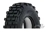 A close-up studio shot of a black Pro-Line 1.9-inch Grunt rock crawler tyre with a blocky tread pattern and white foam insert visible inside.