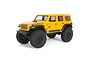 A yellow Axial SCX24 2019 Jeep Wrangler JLU RC rock crawler shown from a front three-quarter angle against a white background.