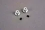 Two silver metal wing buttons and two small black grub screws on a grey surface.