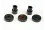 A set of black plastic shock pistons and bushings for Traxxas RC vehicles, arranged on a white background.
