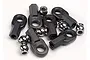 A collection of black plastic rod ends and silver metal pivot balls for RC car suspension linkages.