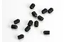 A collection of twelve small black metal grub screws scattered on a white background.