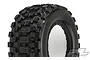 A close-up studio shot of a Pro-Line Badlands MX43 Pro-Loc tyre for X-Maxx, showing the aggressive block tread pattern and sidewall branding.