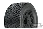 A close-up studio shot of a Pro-Line 3.8 inch Street Fighter HP belted tyre mounted on a black Raid rim.
