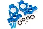 A set of blue anodized aluminium front hub carriers and steering knuckles for an RC vehicle, including bearings, pins, and small grub screws.