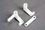 Traxxas steering bellcranks and drag link set, showing two white plastic bellcrank arms and one straight drag link on a grey background.