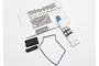 Traxxas receiver box seal kit including a blue O-ring, two foam pads, a tube of grease, and an instruction sheet on a white background.