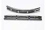 Two black chrome RC car bumpers, one curved and one straight, isolated on a white background.