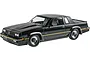 A completed 1/25 scale plastic model of a black 1985 Oldsmobile 442 FE3-X show car, viewed from the front three-quarter angle.