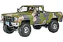 A 1/24 scale plastic model of a 1978 GMC Big Game Country pickup truck featuring a green, tan, and grey camouflage paint scheme.