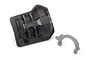 A black Traxxas TRX-6 differential cover and a separate grey T-lock fork component on a white background.