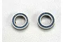 Two Traxxas rubber-shielded ball bearings with blue seals on a white background.
