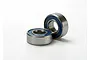 Two Traxxas 5x11x4mm rubber shielded ball bearings with silver metal outer races and blue rubber seals.