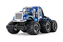 A studio shot of the Tamiya Konghead 6x6 RC monster truck kit, featuring a blue cab, six large off-road tires, and chrome detailing on a white background.