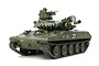 A Tamiya 1/16 scale RC M551 Sheridan tank model in olive drab green with a commander figure and detailed markings on a white background.