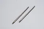Two silver metal turnbuckle rods for RC vehicles against a plain white background.