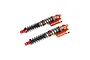 Two orange Rovan Baja RC rear shock absorbers with piggyback reservoirs and black coil springs on a white background.