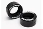 Two black Traxxas rubber wheelie bar tyres with white Traxxas branding on the sidewalls, isolated on a white background.