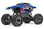 A studio shot of the Maverick Scout RC rock crawler, a blue 1/10 scale electric 4WD truck with large off-road tires and a detailed decal-covered body.